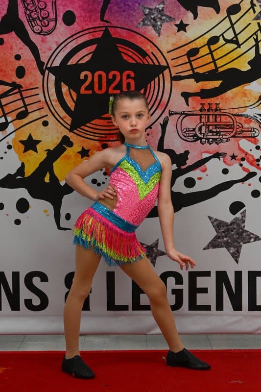 A dancer in a bright fringe costume