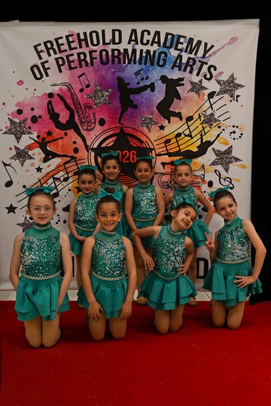 A class in teal sequin costumes